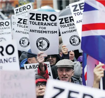  ?? TOLGA AKMEN / AFP / GETTY IMAGES FILES ?? Demonstrat­ors attend a rally organized by the Campaign Against Anti-Semitism outside the Labour Party head office in London in April. British police announced Friday they were probing alleged anti-Semitic hate crimes within the Labour Party.