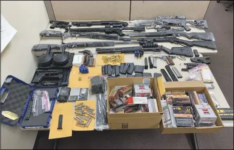  ?? PHOTO COURTESY OF PALMDALE SHERIFF’S STATION ?? This is part of the cache of weapons and drugs seized, man was arrested on several firearms and narcotics-related late Tuesday, during the search of a Palmdale home. One charges.