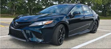  ?? (Robert Duffer/Chicago Tribune/TNS) ?? 2018 Toyota Camry XSE features 19-inch black wheels standard, larger front air intakes, a split X-wing grille, and has a two-inch longer wheelbase and one-inch lower ride height for improved handling and sportier appearance. Pictured at Arlington Park...