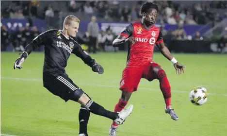  ?? JAE C. HONG/THE CANADIAN PRESS ?? Toronto FC’s Tosaint Ricketts, right, figures to be the lone striker in the Reds’ starting lineup Tuesday when they take on the Columbus Crew in Game 1 of the East Conference final in Columbus. The Reds’ Sebastian Giovinco and Jozy Altidore won’t be in...