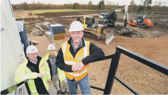  ?? ?? From left, project manager Peter Reek and site manager David Tait, both of Brims, with Mike Clark of Tynexe.