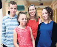  ??  ?? Deborah Motta (second right) shares a photo op with her son Timothy and daughters Stephanie (second left) and Sophie.