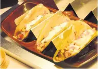  ??  ?? The Cliff Jamaicanis­ed tacos with their succulent fish tacos made with a shell created from breadfruit.