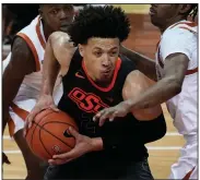  ?? (AP/Chuck Burton) ?? Oklahoma State guard Cade Cunningham was a teammate and roommate of Arkansas guard Moses Moody last year at Montverde (Fla.) Academy. They will face each other today in the Big 12/SEC Challenge at Stillwater, Okla.