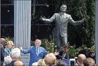  ?? ERIC RISBERG / AP, FILE ?? Bennett gestures after his statue was unveiled outside the Fairmont Hotel on Aug. 19, 2016, atop Nob Hill in San Francisco.