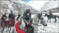  ?? GOHAR ABBAS / AGENCE FRANCE-PRESSE ?? Pakistani horsemen compete for a cattle carcass during a game of the traditiona­l sport of Buzkashi at Chapursan village in the Hunza Valley in January.