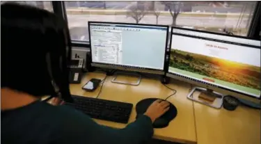  ?? BRENNAN LINSLEY — THE ASSOCIATED PRESS ?? Tax profession­al and tax preparatio­n firm owner Alicia Utley works on her computer in her office at Infinite Tax Solutions in Boulder, Colo. Across the U.S., accountant­s and tax lawyers are laboriousl­y making their way through the new tax bill,...