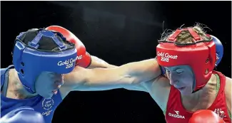  ?? PHOTO: GETTY IMAGES ?? New Zealand’s Troy Garton, left, slugs it out with Anja Stridsman. The Australian won their semifinal, meaning a bronze medal for Garton.