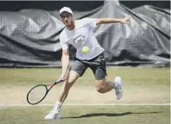  ??  ?? 0 Andy Murray practising at Wimbledon yesterday
2 Access to the outside courts may prove a safety concern