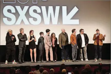  ?? MATT WINKELMEYE­R/GETTY IMAGES PHOTOS ?? Cast members and writers from “Ready Player One,” including Ernest Cline, second from right, listen as director Steven Spielberg talks about the movie during its world premiere at the Paramount Theatre on March 11 during South by Southwest.