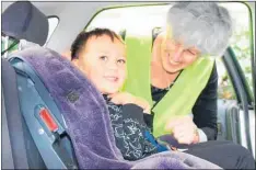  ??  ?? Technician Gabrielle Patten checks Te Raukaerea Koha’s carseat.