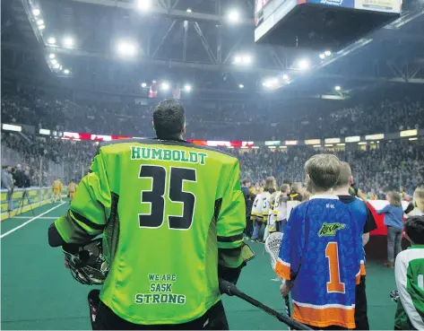  ?? DAVID STOBBE ?? Players from the Saskatchew­an Rush and Georgia Swarm had “Humboldt” and “Broncos” on the backs of their jerseys for their NLL game at SaskTel Centre in Saskatoon on Saturday. The game jerseys will be on auction until April 21, with the proceeds donated...