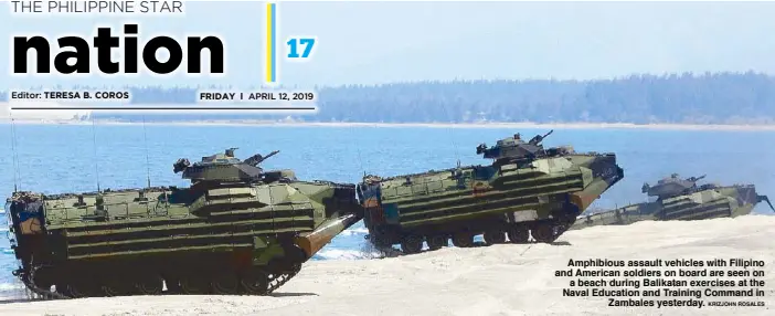  ?? KRIZJOHN ROSALES ?? Amphibious assault vehicles with Filipino and American soldiers on board are seen on a beach during Balikatan exercises at the Naval Education and Training Command in Zambales yesterday.