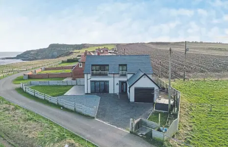  ?? ?? This spectacula­r home in Killerby Cliff, Cayton Bay, is for sale at a price of £725,000 with Hunters estate agents. Contact 01723 336760 for more details.