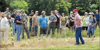  ?? NWA Democrat-Gazette/ANDY SHUPE ?? Ken Coffey, co-owner of a sheep and goat farm near Prairie Grove, talks about fencing Wednesday to military veterans participat­ing in the Armed to Farm program.