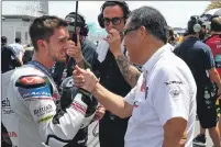  ??  ?? John is congratula­ted on his fine fifth place finish in Sepang.