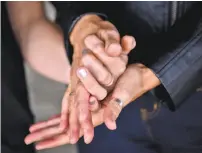  ?? Stuart Palley / Special to The Chronicle ?? Connie Lurie, top, and Ed LeClair, center, were among those working to free Kevin Sherbondy. Above, Sherbondy’s daughter Chanel Juzaitis holds her mother’s hands.