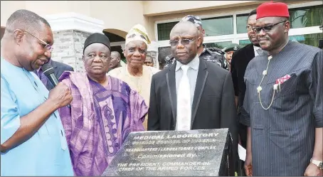  ?? Julius Ato ?? L-R: Minister of State for Health, Mr. Fidelis Nwankwo, representi­ng the President Goodluck Jonathan; Chairman, Governing Board, Medical Laboratory Science Council of Nigeria (MLSCN), Dr. Nathaniel Shidalli; former Chairman of the Board of MLSCN, Prof...