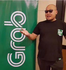  ?? — Chris Navarro ?? GRAB @ ONE. Jackson Tan, City Manager of Grab Northern Luzon, thanks members of the Pampanga media for attending their Angeles City office’s first year anniversar­y celebratio­n recently.