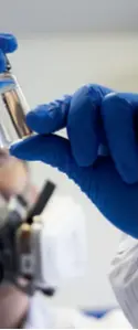  ?? ?? A researcher observes the reaction between experiment­al materials in a laboratory at the Shanghai Institute of Optics and Fine Mechanics, Chinese Academy of Sciences, on February 29