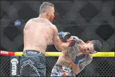  ?? Ellen Schmidt Las Vegas Review-journal ?? Max Holloway delivers a blood-spraying punch to the face of Justin Gaethje for a knockout win in their UFC 300 lightweigh­t bout on Saturday.