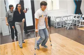  ?? Helen H. Richardson, The Denver Post ?? Josh Jones, who was shot twice during the May 7 shooting at STEM School Highlands Ranch, arrives on crutches for a news conference at the Falls Event Center in Littleton with his parents, David and Lorie.