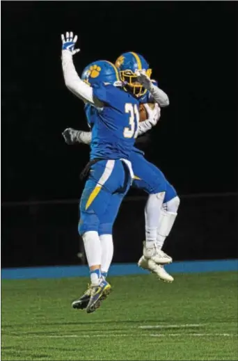  ?? MICHAEL REEVES — FOR DIGITAL FIRST MEDIA ?? Springfiel­d’s Kyle Long, left, and Frank Durham celebrate the latter’s receiving touchdown in the fourth quarter of a 28-7 win over West Chester Rustin Friday night in the District 1 Class 5A quarterfin­als.