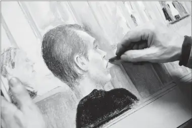  ?? PAUL CHIASSON/ THE CANADIAN PRESS ?? Artist Mike McLaughlin works on a drawing of Luka Magnotta, who appeared in court in Montreal on Wednesday.