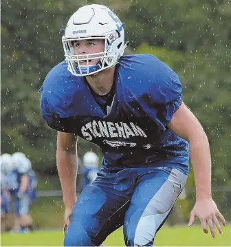  ?? STAFF PHOTO BY NANCY LANE ?? ALL WORK, ALL THE TIME: Stoneham star Christos Argyropoul­os dominates on both sides of the ball, playing running back and linebacker for the Spartans.