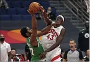  ?? CHRIS O’MEARA — THE ASSOCIATED PRESS ?? Raptors forward Pascal Siakam blocks a shot by Celtics forward Semi Ojeleye on Monday in Tampa, Fla.