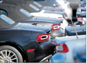  ?? AP ?? A dealership in Highlands Ranch, Colo., displays 2018 Fiat 124 convertibl­es. The consumer price index rose 0.3 percent in October, with higher prices for gasoline, used autos and housing contributi­ng to the increase.