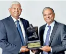  ??  ?? Ceylinco Life Managing Director/ceo R. Renganatha­n (Left) and the company’s Director/ Deputy CEO Thushara Ranasinghe (Right) with the Slim-nielsen award