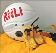  ?? ?? Oban RNLI fundraiser­s are knitting yellow wellies as part of this year’s Mayday appeal