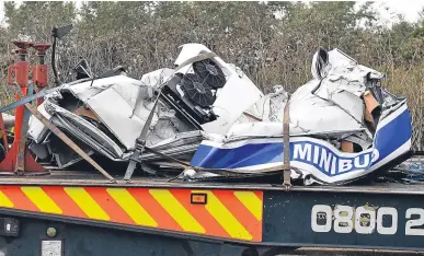  ??  ?? The crumpled wreck of the minibus following yesterday’s tragedy on the M1.