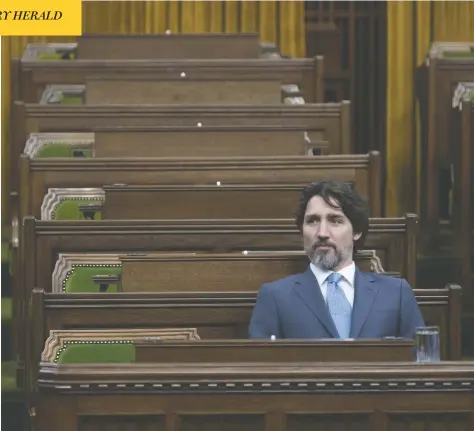  ?? ADRIAN WYLD / THE CANADIAN PRESS ?? Prime Minister Justin Trudeau waits for the Special Committee on the COVID-19 Pandemic to begin in the House of Commons Wednesday.
