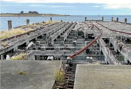  ?? JOHN HAWKINS ?? The old Bluff wharf in 2017 – views diverge on whether it could be made an acceptable place for wharf-jumping.