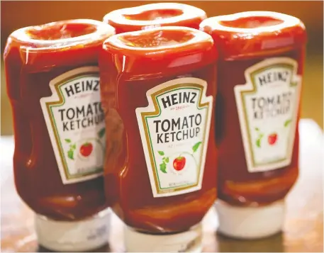  ?? PHOTO ILLUSTRaTI­ON BY SCOTT OLSON/GETTY IMAGES FILES ?? The Kraft Heinz ketchup factory in Mount Royal, Que., will start running next summer and will create 30 new jobs, part of a US$100-million capital investment in the company's Canadian operations.