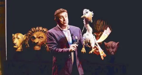  ?? Photos by NEAL P. CORPUS ?? Fly high: The Lion King associate director Anthony Lyn demonstrat­ing the puppet for Zazu.