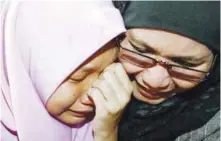  ??  ?? A tearful Nur Darleen (left) is reunited with her mother after her ordeal.