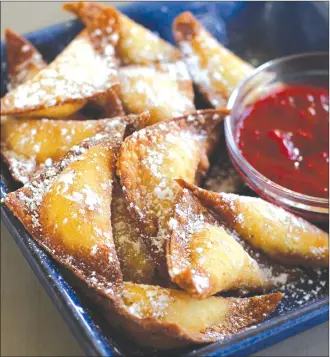  ?? Associated Press photo ?? This photo shows fried sweet cheese and almond dumplings in Concord, N.H.