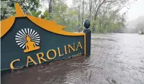  ?? PHOTO: REUTERS ?? Flooding . . . A sign for the Buddhist Associatio­n of North Carolina is partially submerged as waters rise after Hurricane Florence swept through, in Bolivia, North Carolina, on Saturday.