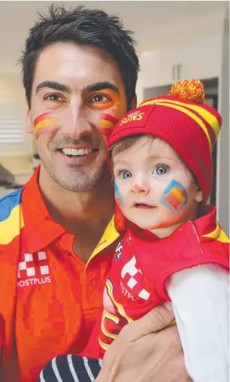  ?? Picture: MIKE BATTERHAM ?? Otis, son of Gold Coast Suns star Matt Rosa, gets his face painted to show his support for dad ahead of the clash with Collingwoo­d at Metricon Stadium on Saturday.