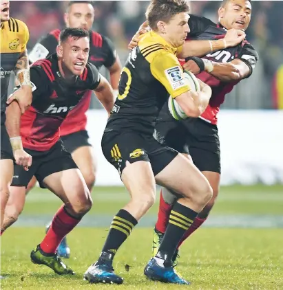  ?? PICTURE: Getty Images ?? Shut-out: Crusaders defenders swarm around Beauden Barrett