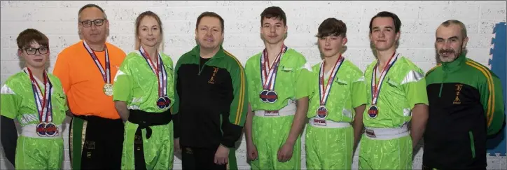  ??  ?? The members of Wexford Kung Fu and Kickboxing Club who were successful in the U.S.A. (from left): Nathan Casserly, Pat Monahan (referee), Michelle Casserly, Bobby O’Neill (coach), Cathal Moran, Adam Tierney, Eoghan Dempsey, Mark Rowe (coach).