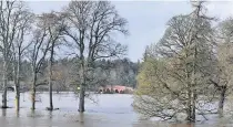  ??  ?? On the rise The River Isla burst its banks and flooded fields close to Kinclaven Bridge