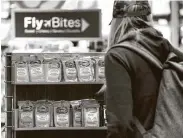  ?? Erin Schaff / New York Times ?? A traveler snags some Clorox disinfecta­nt wipes for sale in a store at Dulles Internatio­nal Airport.