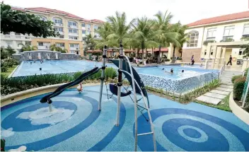  ?? SUNSTAR FOTO / ARNI ACLAO ?? PERKS. The swimming pool and playground are some of the amenities at Sanremo Oasis.