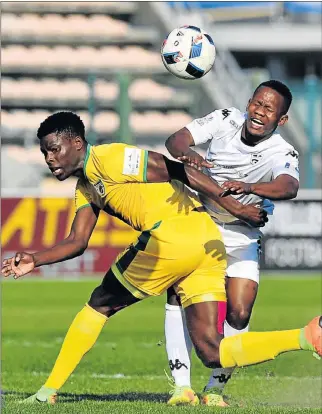  ?? Picture: BACKPAGEPI­X ?? FIGHTING FOR IT: Stanley Muishond of Stellenbos­ch FC, right, is tackled by Baroka’s Nyasha Munetsi during their playoff match yesterday