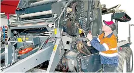  ?? ?? TTMI Trafalgar Leading Hand/Service Technician Rob Hender performing pre-season checks on a Kuhn baler-wrapper.