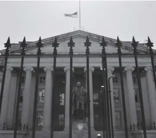  ?? BLOOMBERG NEWS ?? The US Treasury Department Building is shown enclosed by a steel fence.